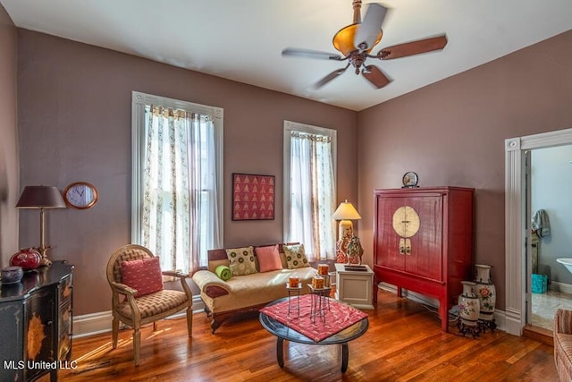 612 State St, Natchez, MS 39120 - living area featuring wood finished floors, a ceiling fan, and baseboards
