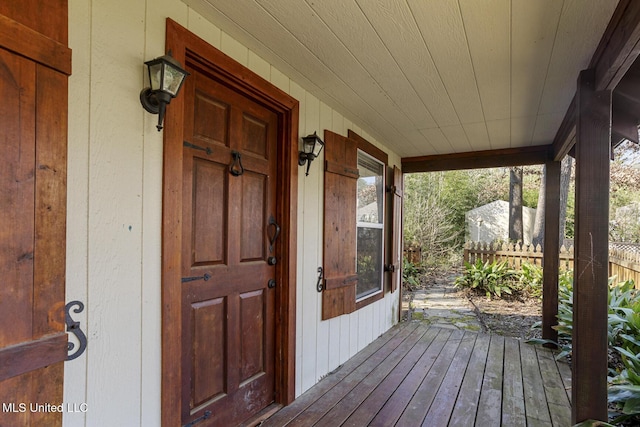 wooden deck with fence and covered porch