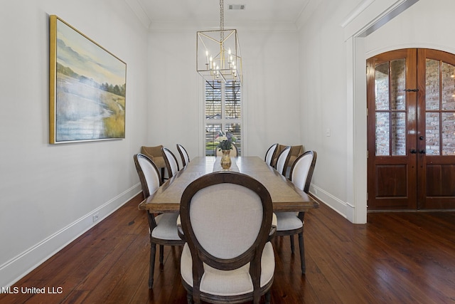 dining area featuring baseboards, a chandelier, ornamental molding, french doors, and dark wood-style flooring