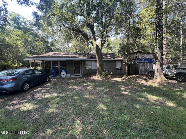 4008 Somerset Dr, Moss Point, MS 39562 - view of front facade featuring a front lawn and brick siding