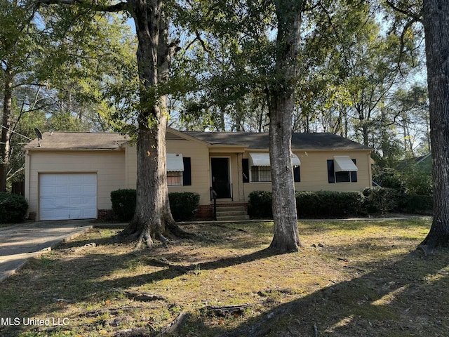 single story home featuring a front yard and a garage