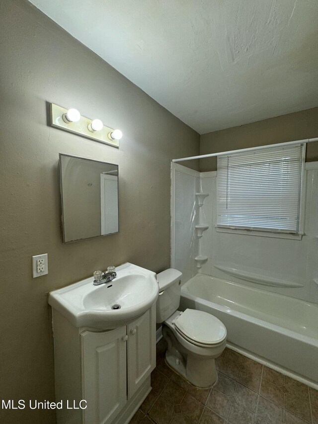 full bathroom with vanity, toilet, and shower / washtub combination