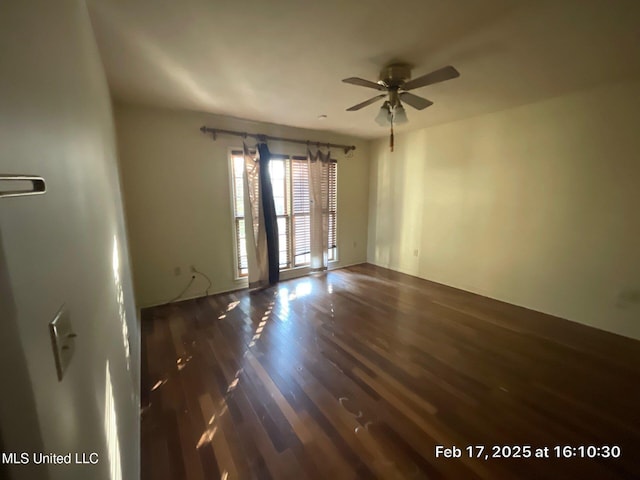 unfurnished room featuring ceiling fan and wood finished floors