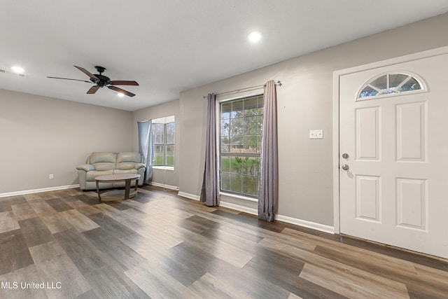 foyer with dark wood-type flooring and ceiling fan