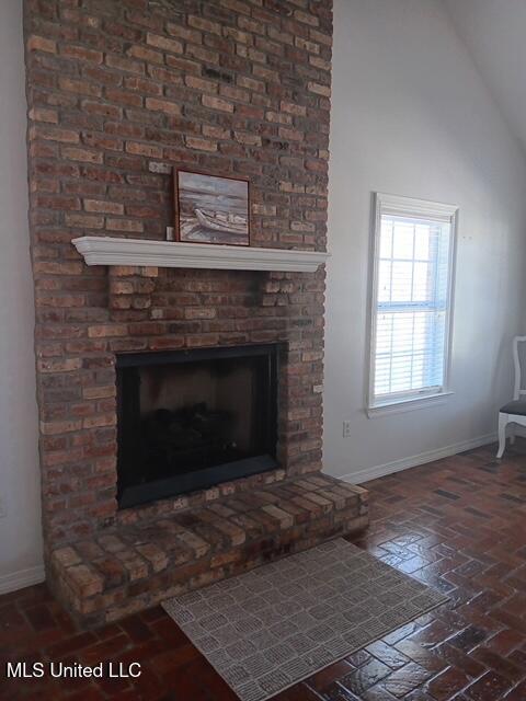 9900 Little Buck, Vancleave, MS 39565 - detailed view of baseboards and a brick fireplace