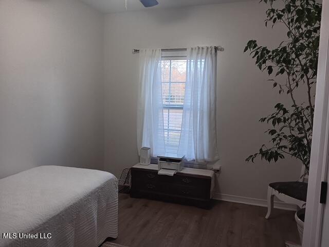 9900 Little Buck, Vancleave, MS 39565 - bedroom featuring wood finished floors, a ceiling fan, and baseboards
