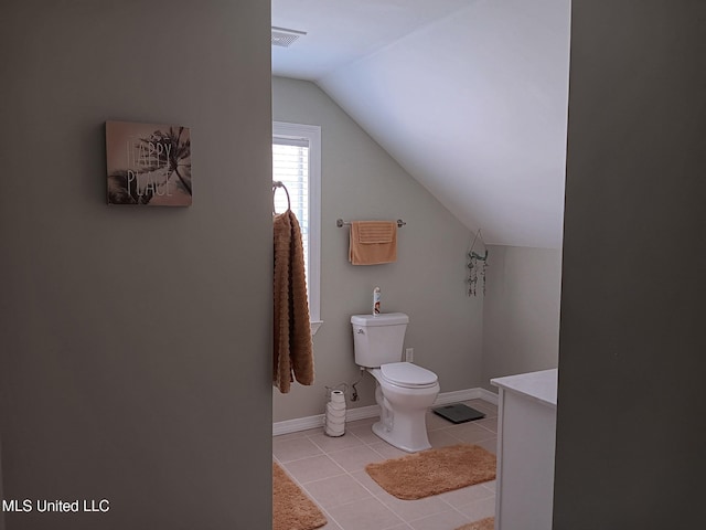 9900 Little Buck, Vancleave, MS 39565 - bathroom featuring lofted ceiling, toilet, tile patterned flooring, and baseboards