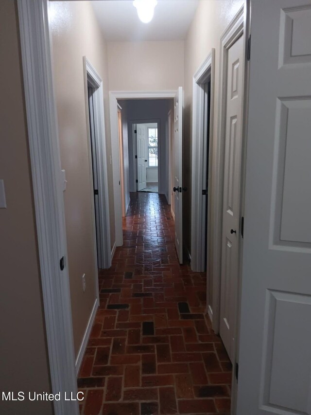 9900 Little Buck, Vancleave, MS 39565 - hallway with brick flooring and baseboards