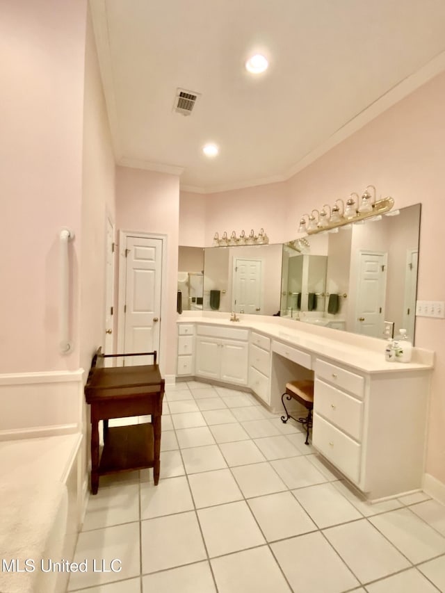 bathroom featuring tile patterned flooring, vanity, and ornamental molding