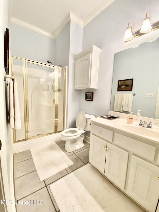 bathroom featuring tile patterned floors, vanity, ornamental molding, and walk in shower