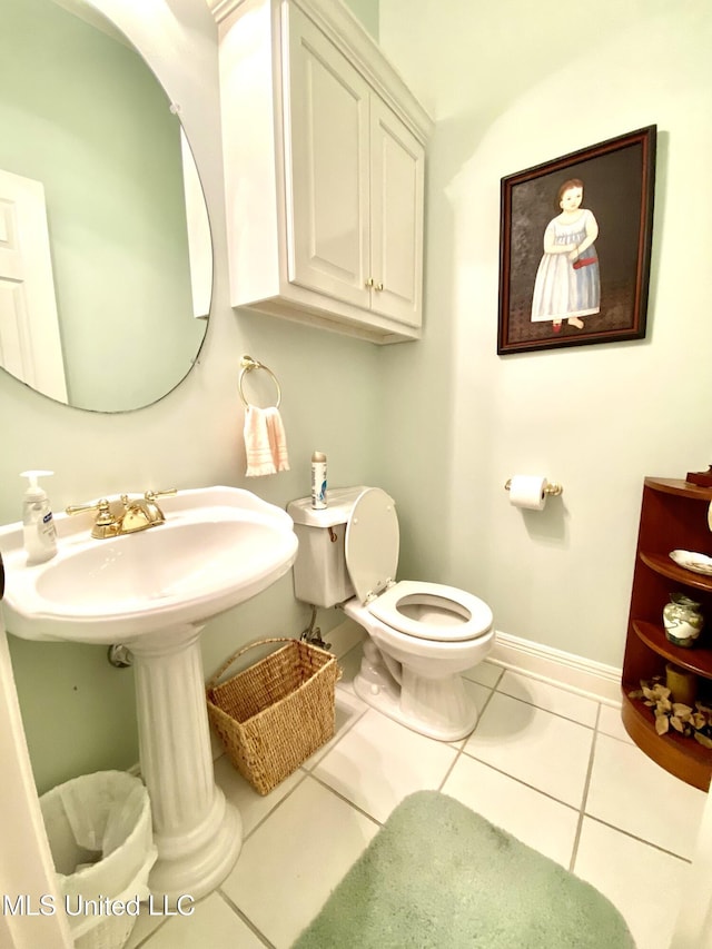 bathroom featuring tile patterned flooring and toilet