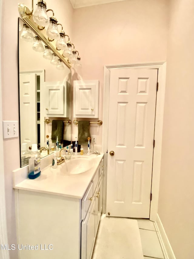 bathroom with tile patterned flooring and vanity