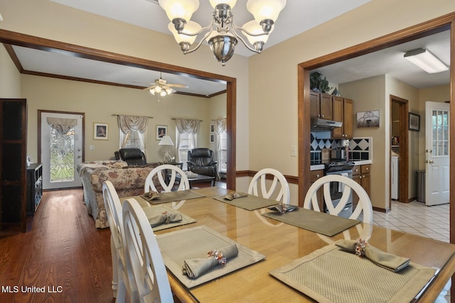 725 Bay Tree Dr, Flowood, MS 39232 - dining space featuring a chandelier, a ceiling fan, and ornamental molding