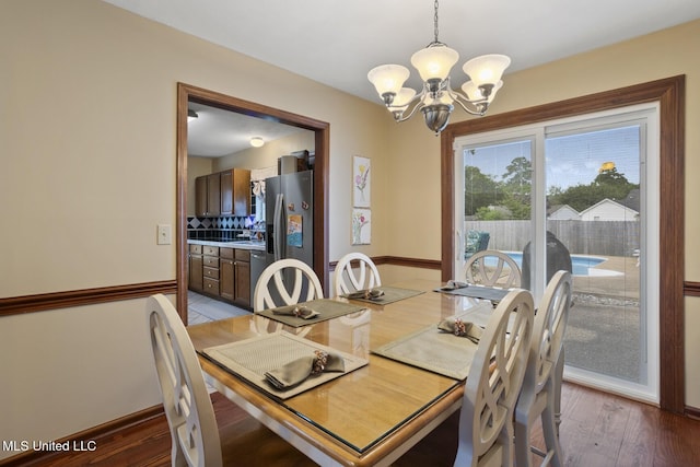 725 Bay Tree Dr, Flowood, MS 39232 - dining room with a chandelier and wood finished floors