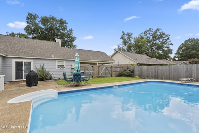 725 Bay Tree Dr, Flowood, MS 39232 - view of pool with a fenced backyard, a diving board, a patio area, and outdoor dining area