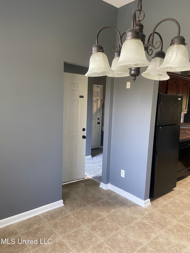 unfurnished dining area with light tile patterned floors