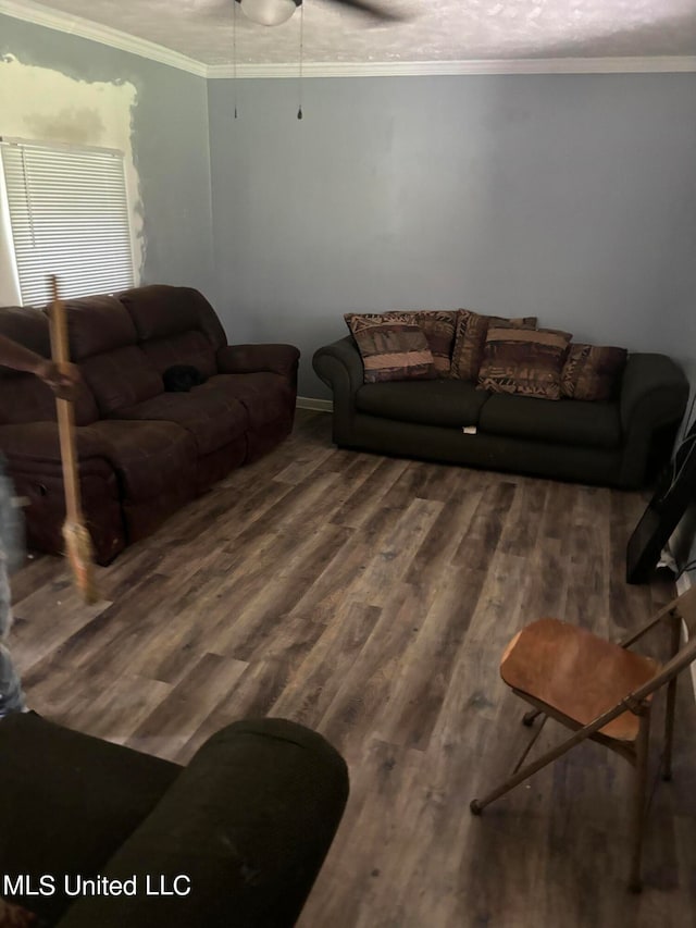 living room featuring ceiling fan, ornamental molding, and hardwood / wood-style floors