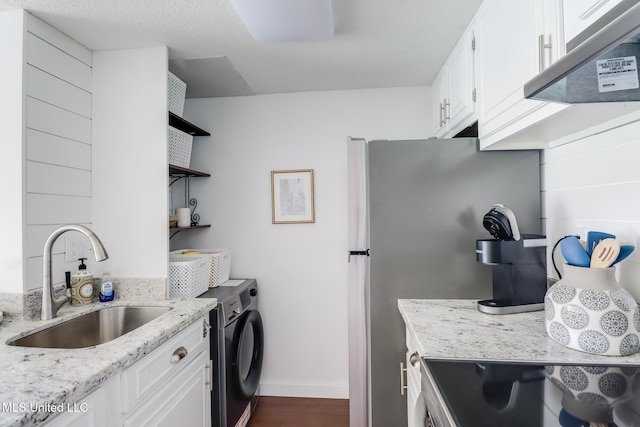 138 Molokai Vlg Unit J, Diamondhead, MS 39525 - kitchen featuring a sink, open shelves, baseboards, under cabinet range hood, and white cabinetry