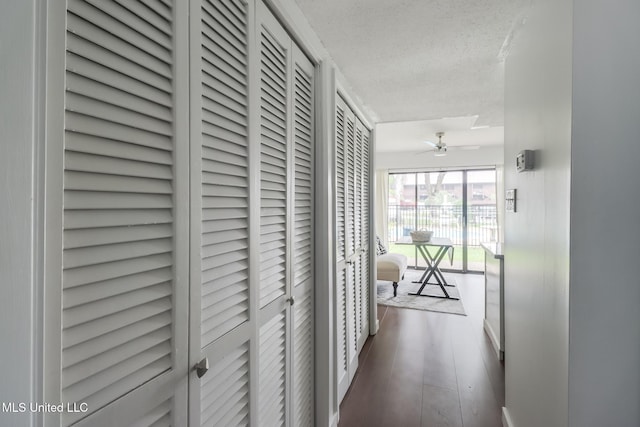 138 Molokai Vlg Unit J, Diamondhead, MS 39525 - corridor featuring a textured ceiling