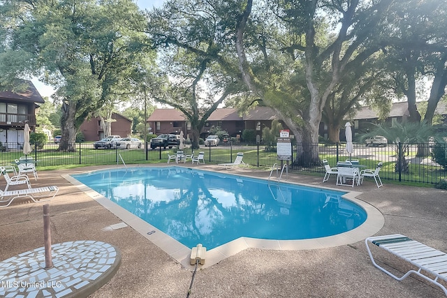 138 Molokai Vlg Unit J, Diamondhead, MS 39525 - community pool featuring fence, a residential view, and a patio area
