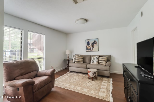 138 Molokai Vlg Unit J, Diamondhead, MS 39525 - living room with dark wood-style floors and baseboards