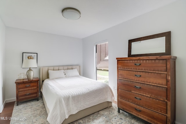 138 Molokai Vlg Unit J, Diamondhead, MS 39525 - bedroom with light wood-style floors and baseboards