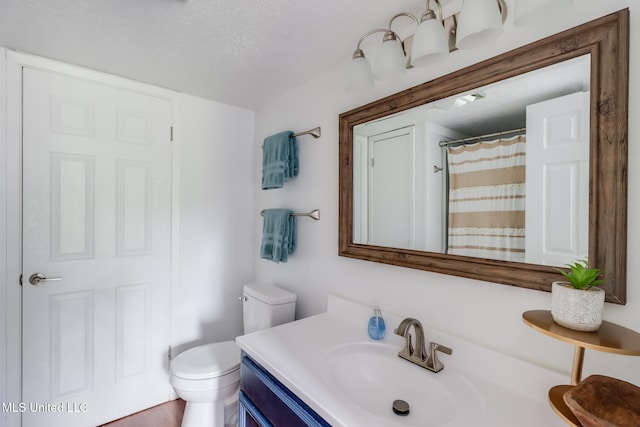 138 Molokai Vlg Unit J, Diamondhead, MS 39525 - full bath featuring toilet, vanity, and a shower with shower curtain