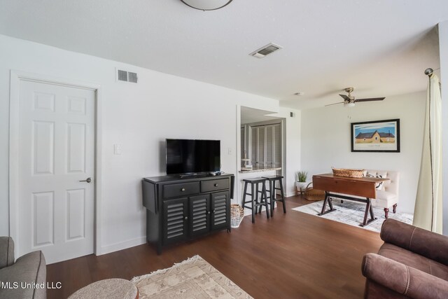 138 Molokai Vlg Unit J, Diamondhead, MS 39525 - living area with ceiling fan, wood finished floors, and baseboards