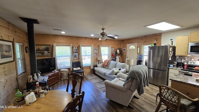 22386 Ms Highway 32, Oakland, MS 38948 - living room with wood finished floors, wood walls, a wealth of natural light, and ceiling fan