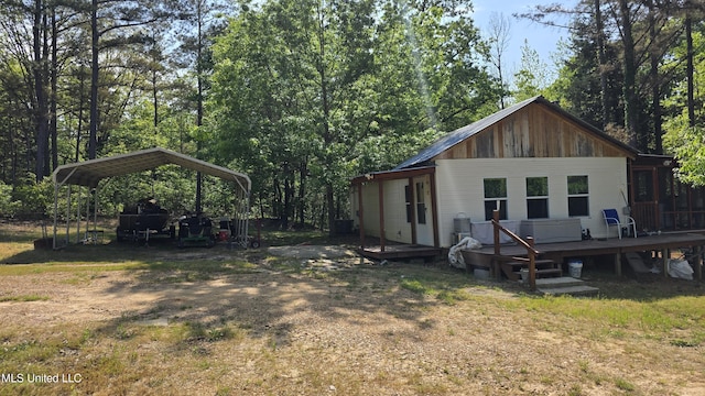 22386 Ms Highway 32, Oakland, MS 38948 - back of property featuring a wooden deck and a carport