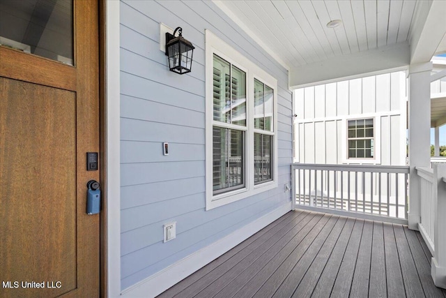 wooden terrace with a porch