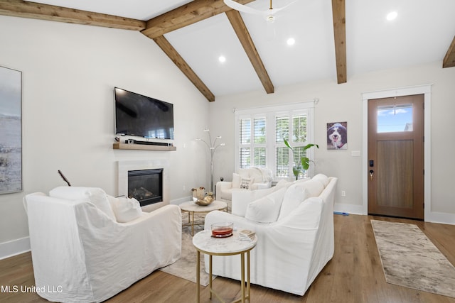 living room featuring high vaulted ceiling, wood-type flooring, and beamed ceiling