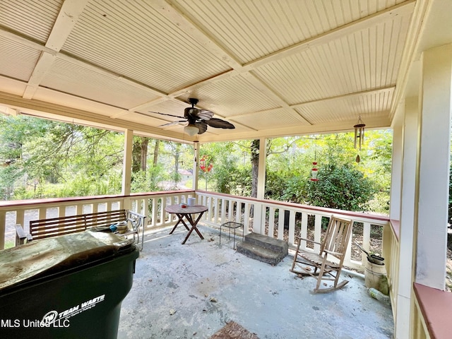 wooden deck featuring ceiling fan