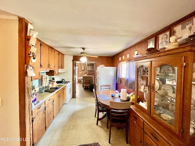 kitchen featuring ventilation hood, sink, white appliances, and ceiling fan