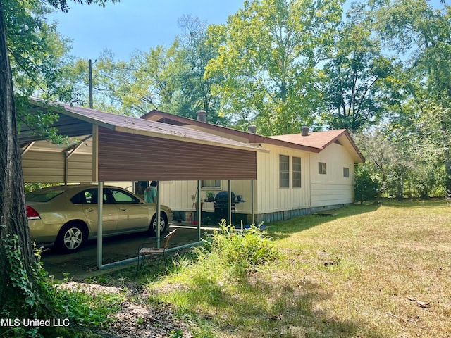 view of property exterior with a lawn and a carport