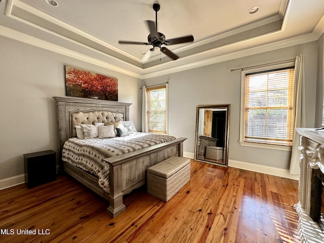 121 Vinca Dr, Madison, MS 39110 - bedroom featuring a raised ceiling, crown molding, hardwood / wood-style floors, baseboards, and a ceiling fan
