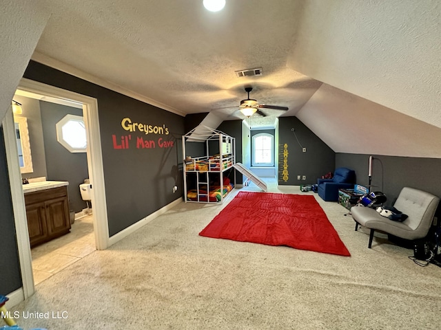 121 Vinca Dr, Madison, MS 39110 - rec room with a textured ceiling, light colored carpet, ceiling fan, lofted ceiling, and baseboards