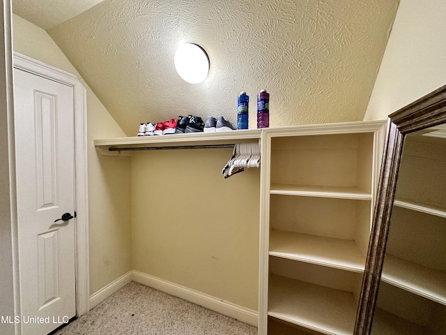 121 Vinca Dr, Madison, MS 39110 - walk in closet with vaulted ceiling and carpet floors