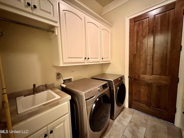 121 Vinca Dr, Madison, MS 39110 - clothes washing area with cabinet space, washing machine and clothes dryer, and light tile patterned floors