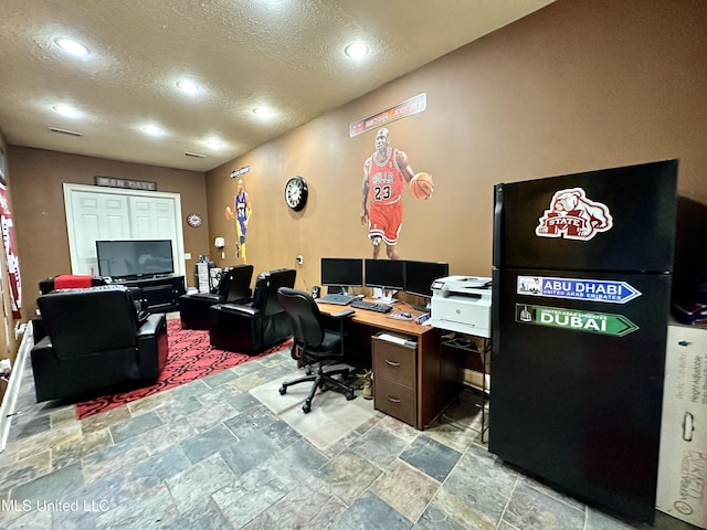 121 Vinca Dr, Madison, MS 39110 - home office featuring a textured ceiling, stone tile flooring, and recessed lighting