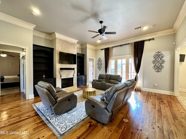 121 Vinca Dr, Madison, MS 39110 - living area featuring ceiling fan, ornamental molding, a fireplace, wood finished floors, and baseboards