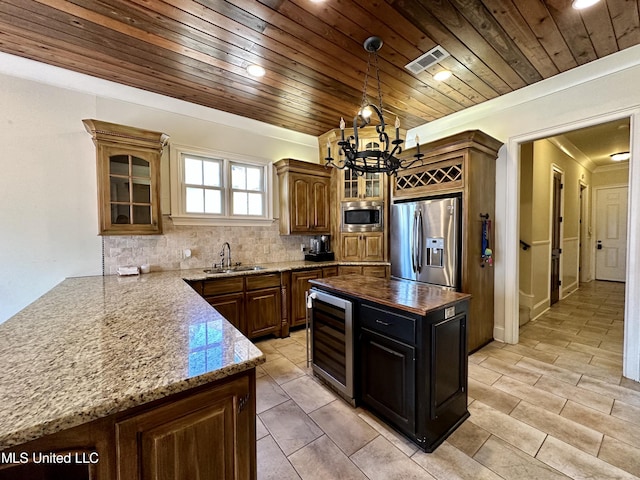 121 Vinca Dr, Madison, MS 39110 - kitchen featuring appliances with stainless steel finishes, beverage cooler, a sink, a chandelier, and wooden ceiling