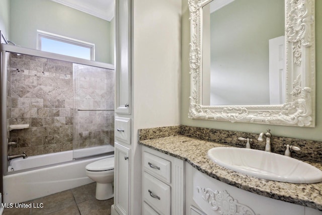 full bathroom featuring tiled shower / bath combo, toilet, crown molding, tile patterned floors, and vanity