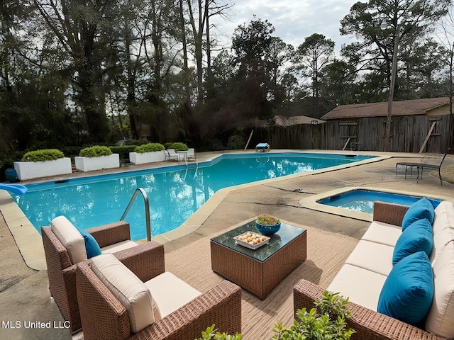 view of pool featuring an outdoor hangout area, a jacuzzi, a patio, and a diving board