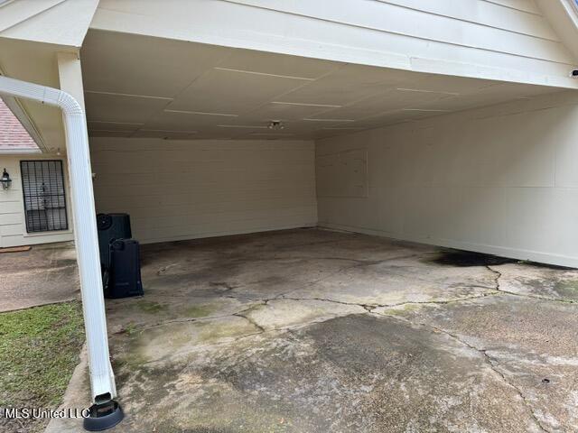 garage with a carport