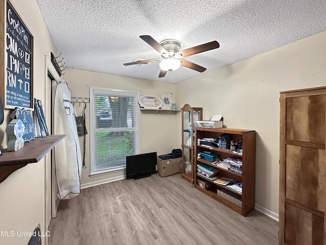 1008 Normandy Dr, Clinton, MS 39056 - office space featuring wood finished floors, a ceiling fan, a textured ceiling, and baseboards