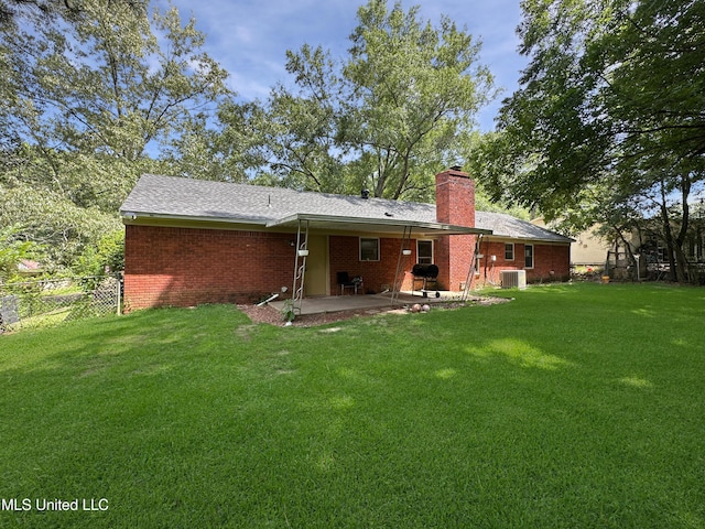 1008 Normandy Dr, Clinton, MS 39056 - back of property featuring a patio, a chimney, cooling unit, and brick siding
