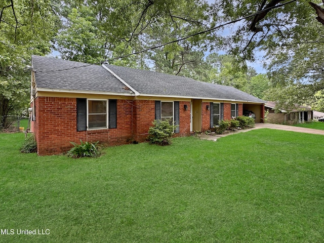 1008 Normandy Dr, Clinton, MS 39056 - single story home featuring a shingled roof, concrete driveway, a front lawn, and brick siding