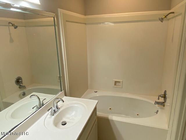 4 Foxcroft Ct, Madison, MS 39110 - bathroom with a combined bath / shower with jetted tub and vanity