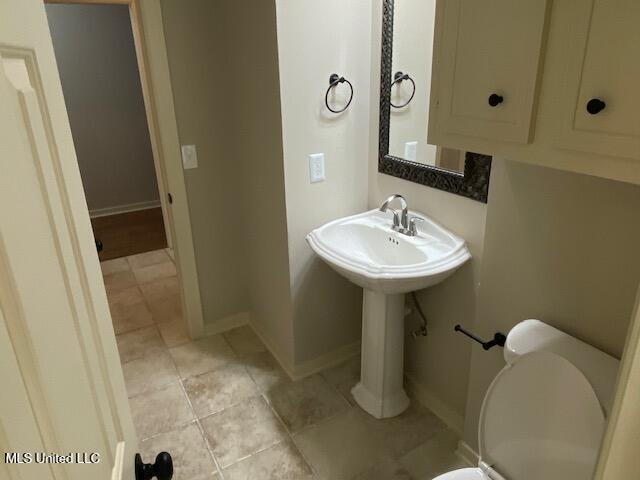 4 Foxcroft Ct, Madison, MS 39110 - half bath with tile patterned floors, baseboards, and toilet